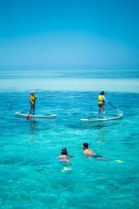 Ride & Slide by South Sea Cats - Half Day Snorkelling Trip - Using the giant inflatable slide from the roof