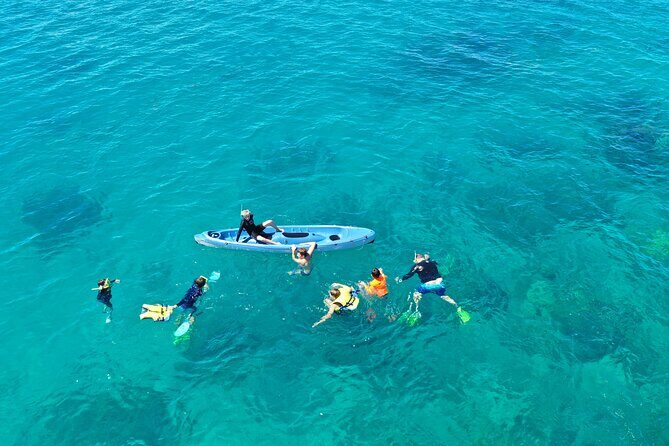 Ride & Slide by South Sea Cats - Half Day Snorkelling Trip - Using the giant inflatable slide from the roof